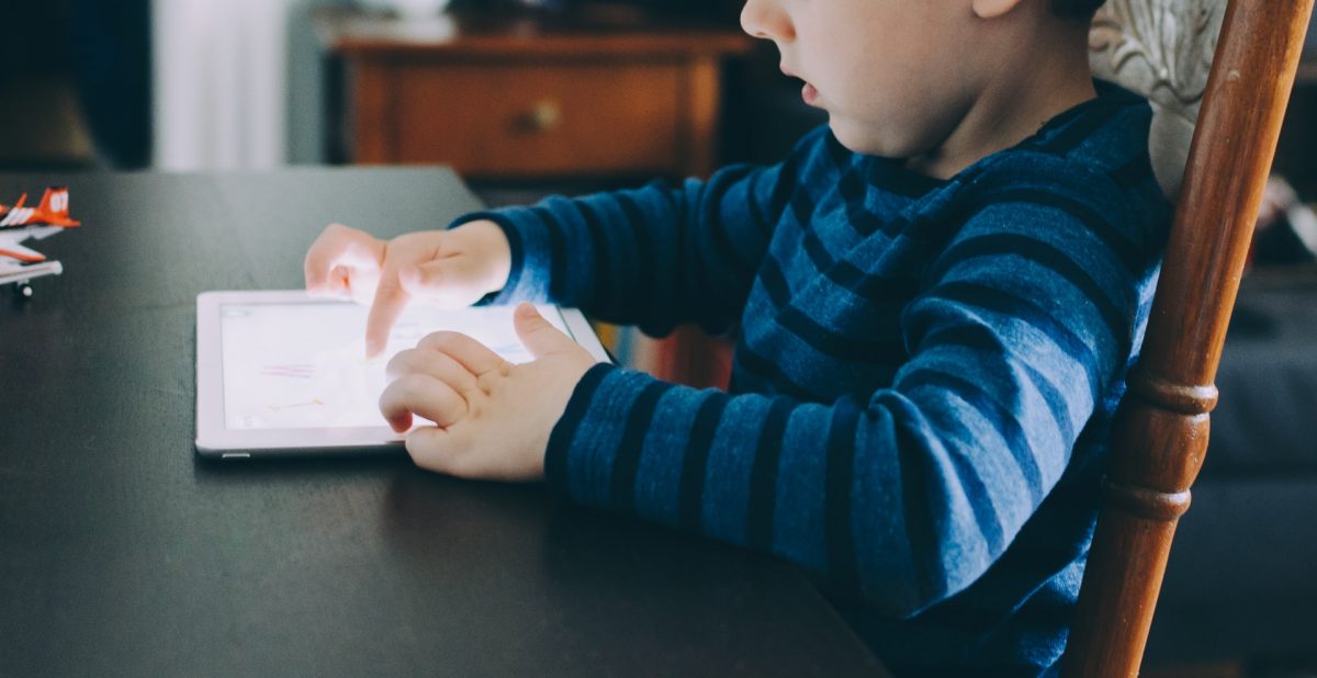 Child looking at a tablet device